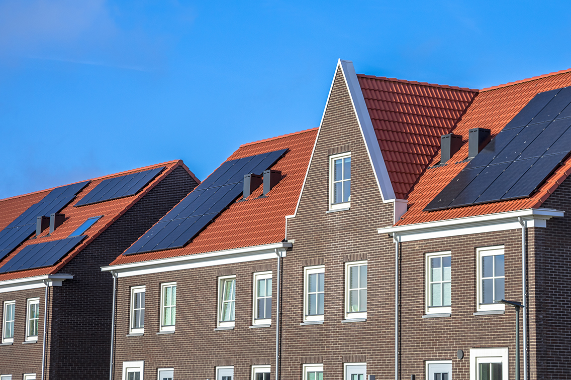 close-up-of-modern-row-houses-with-solar-panels-P72ZCRD